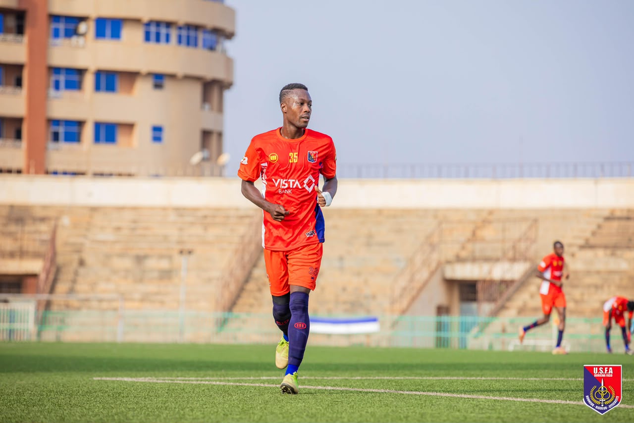 Sanou during a match, away kit