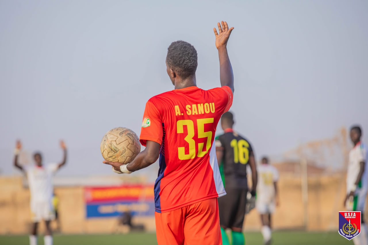 Sanou preparing for a throw-in, nameplate reads A. Sanou