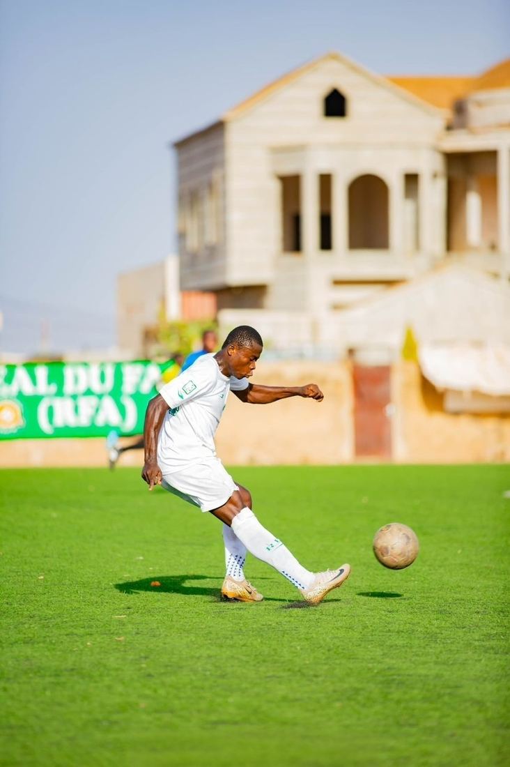 Sawadogo striking the ball in match action