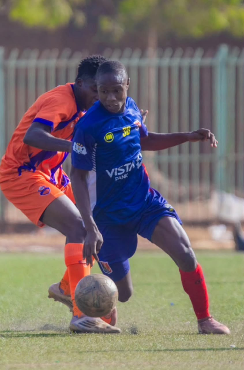 Touré in a defensive duel, blue kit No.38